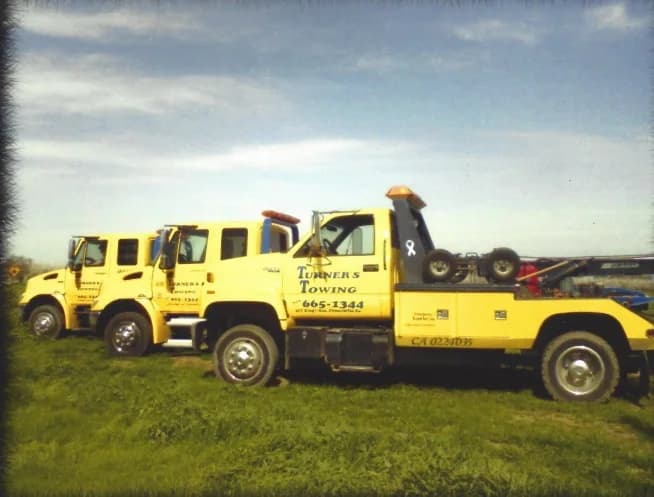 Historic lineup of yellow Turner’s Towing trucks from the company’s earliest years serving Chowchilla
